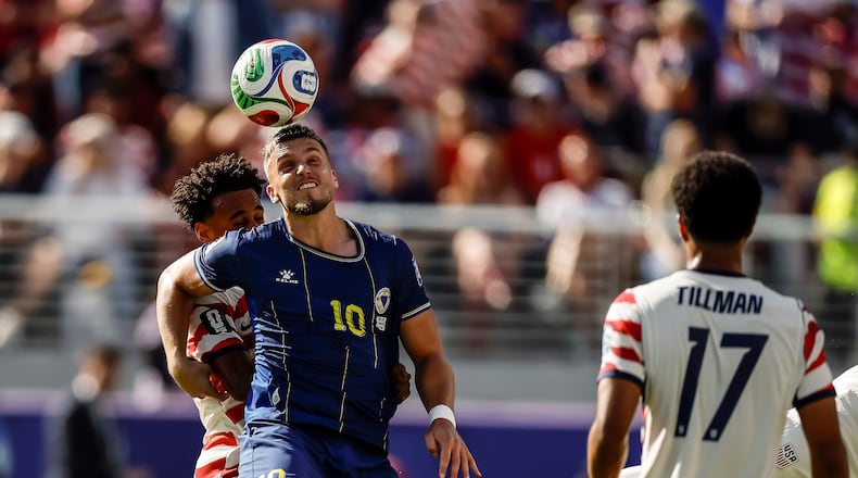 Bosnia and Herzegovina's Ermedin Demirovic (10) heads the ball in the first half of a 2026 FIFA World Cup Round of 32 match against the United States at Levi's Stadium in Santa Clara, Calif., near San Francisco, Wednesday, July 1, 2026. (Carlos Avila Gonzalez/San Francisco Chronicle via AP)