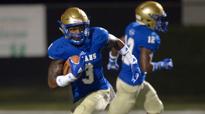 High School football: McEachern senior Valerian Agbaw Jr. (3) moves the ball downfield in the first half of Friday's home game against Cedar Grove. (Daniel Varnado/Special)