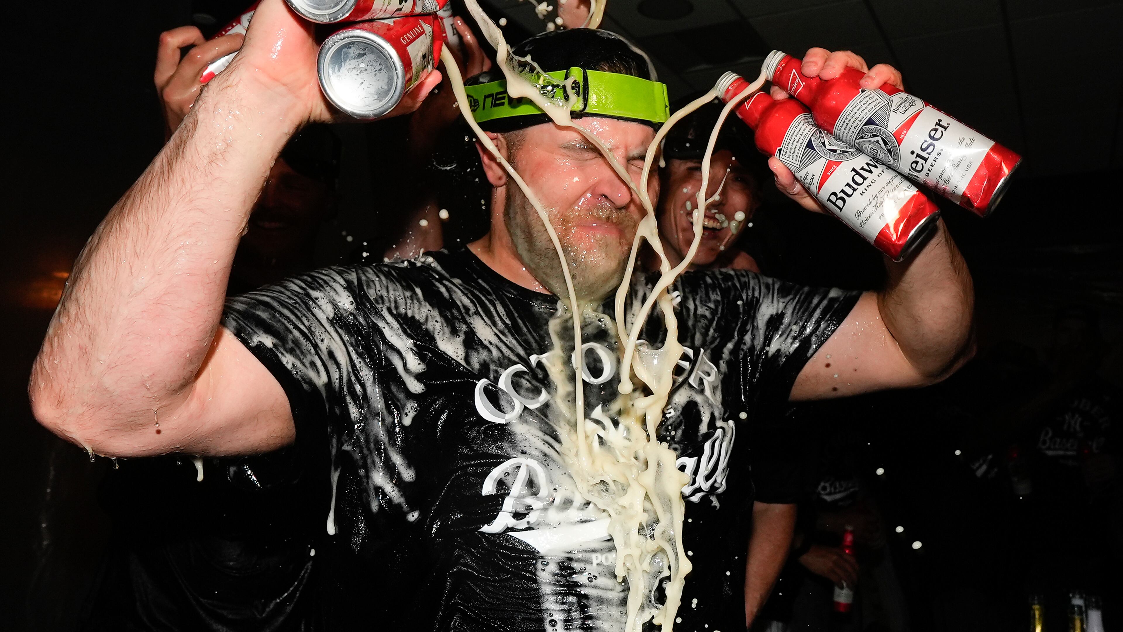 New York Yankees pitcher David Bednar (53) sprays himself with beer while celebrating with teammates after the Yankees defeated the Boston Red Sox in Game 3 of an American League wild-card baseball playoff series, Thursday, Oct. 2, 2025, in New York. (AP Photo/Yuki Iwamura)
