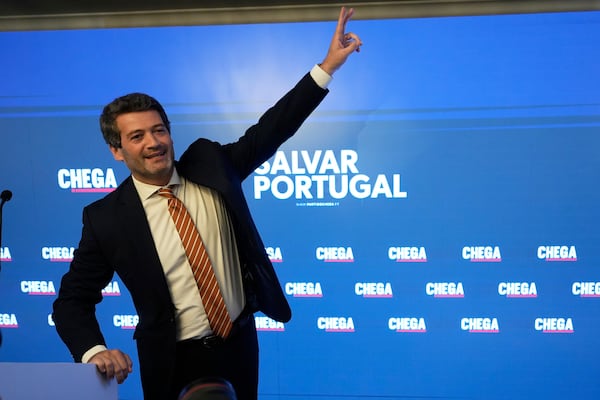 "The hard-right populist party Chega" leader Andre Ventura gestures before addressing media and his supporters, following Portugal's general election, in Lisbon, Monday, May 19, 2025. (AP Photo/Ana Brigida)