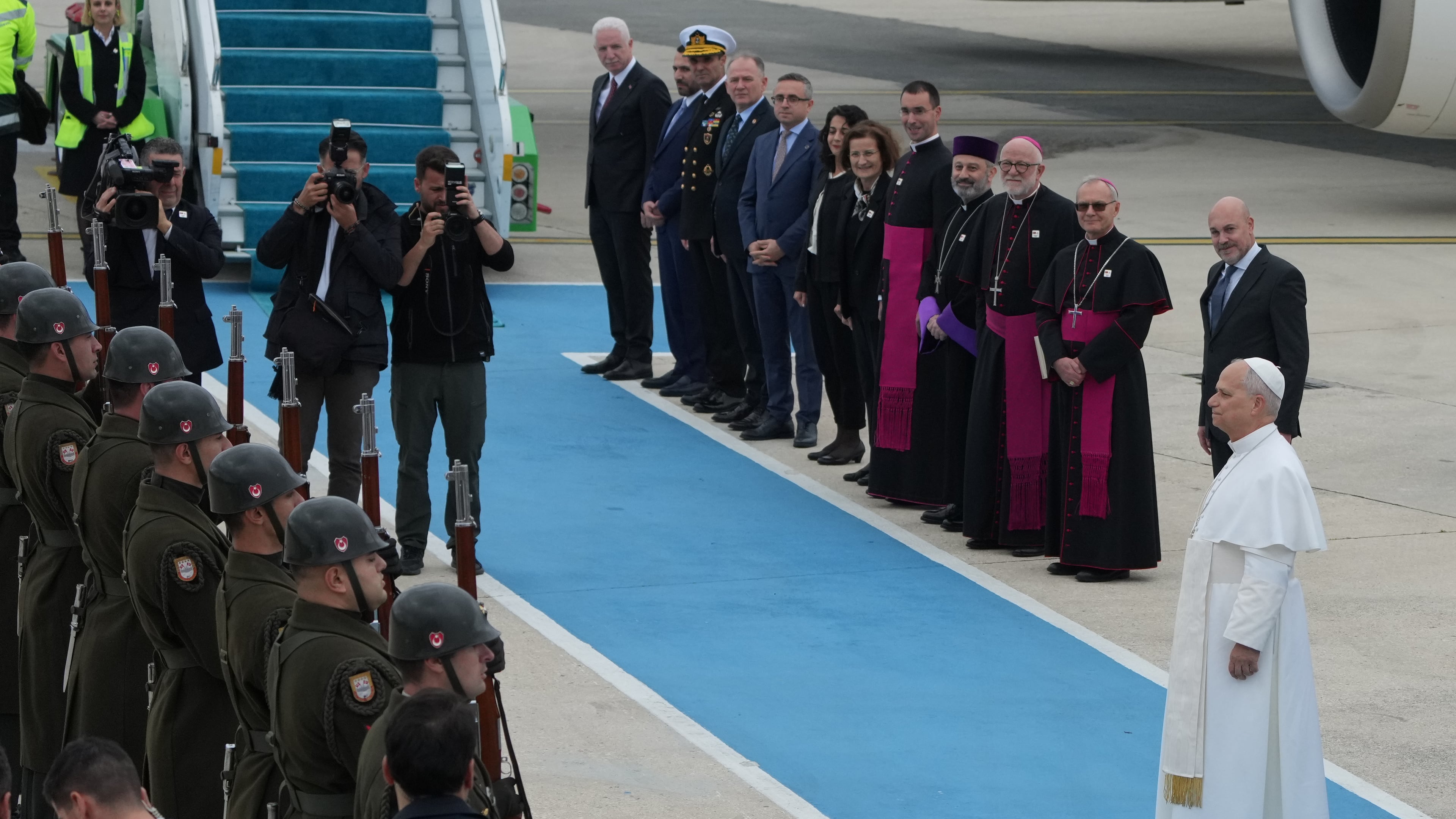 Pope Leo XIV reviews an honor guard during a farewell ceremony before boarding a plane bound to Beirut, Lebanon, at Ataturk airport, in Istanbul, Turkey, Sunday, Nov. 30, 2025. (AP Photo/Dilara Acikgoz)