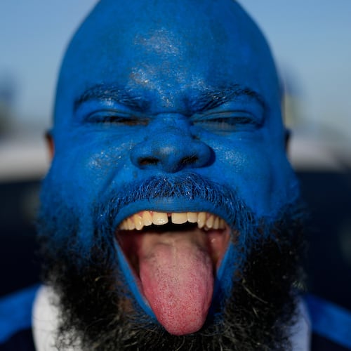 Brenton Balentien, known as Blue Face, a leader of supporters of Curacao’s national soccer team, poses wearing face paint in the team’s colors in Willemstad, Curacao, Saturday, May 16, 2026. (AP Photo/Matias Delacroix)