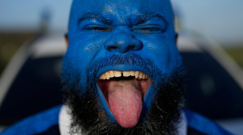 Brenton Balentien, known as Blue Face, a leader of supporters of Curacao’s national soccer team, poses wearing face paint in the team’s colors in Willemstad, Curacao, Saturday, May 16, 2026. (AP Photo/Matias Delacroix)