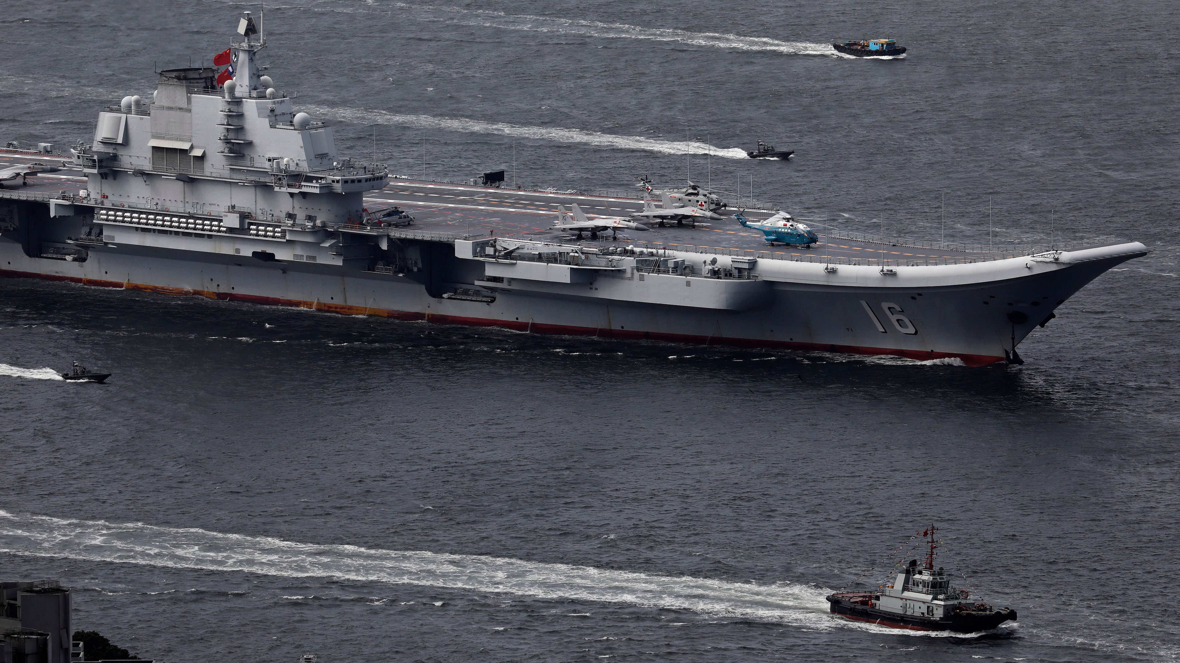 FILE -The Liaoning, China's first aircraft carrier, sails into Hong Kong for a port call to celebrate the 20th anniversary of the People's Liberation Army (PLA) garrison's presence in the semi-autonomous Chinese city and former British colony on July 7, 2017. (AP Photo/Vincent Yu, File)