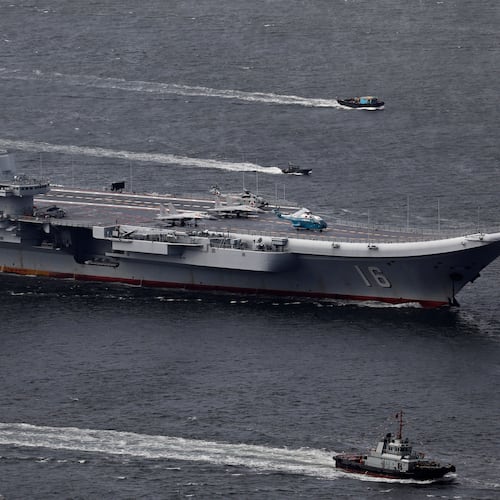 FILE -The Liaoning, China's first aircraft carrier, sails into Hong Kong for a port call to celebrate the 20th anniversary of the People's Liberation Army (PLA) garrison's presence in the semi-autonomous Chinese city and former British colony on July 7, 2017. (AP Photo/Vincent Yu, File)