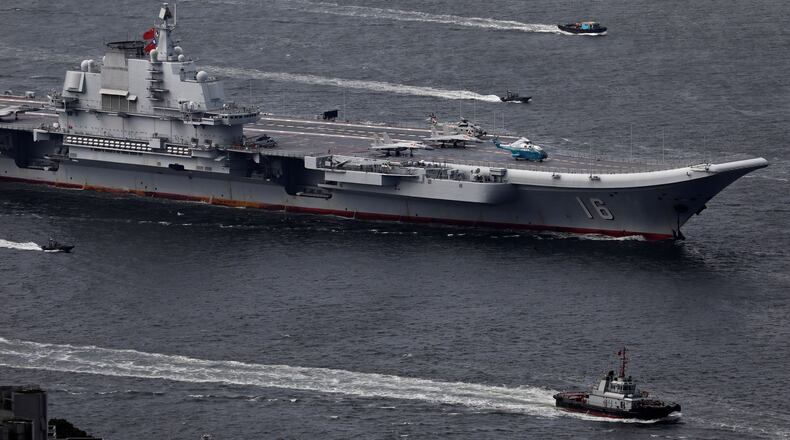 FILE -The Liaoning, China's first aircraft carrier, sails into Hong Kong for a port call to celebrate the 20th anniversary of the People's Liberation Army (PLA) garrison's presence in the semi-autonomous Chinese city and former British colony on July 7, 2017. (AP Photo/Vincent Yu, File)