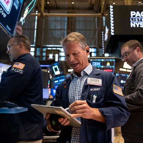 Trader Robert Charmak works on the floor of the New York Stock Exchange in New York, Friday, Aug. 21, 2026. (AP Photo/Yuki Iwamura)