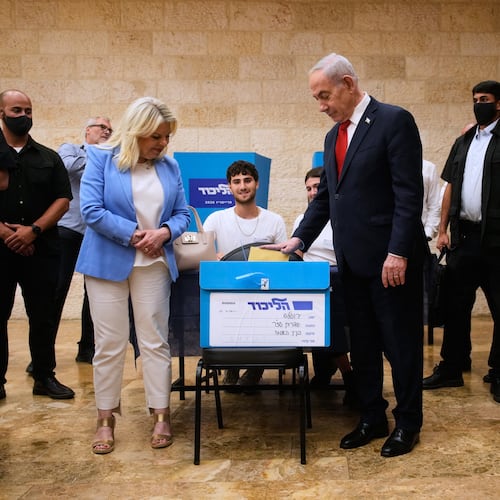 Israeli Prime Minister Benjamin Netanyahu, right, and his wife, Sara, cast their ballots in the Likud party primary elections ahead of Israel's general election in October, in Jerusalem, Monday, Aug. 17, 2026. (AP Photo/Ohad Zwigenberg, Pool)