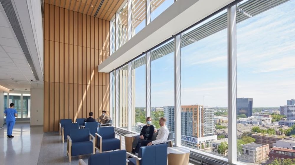 In the Winship at Emory Midtown care community lounges, which join inpatient and outpatient floors, patients and their families can socialize with other patients and families facing the same type of cancer. Photo by Dave Burk © SOM