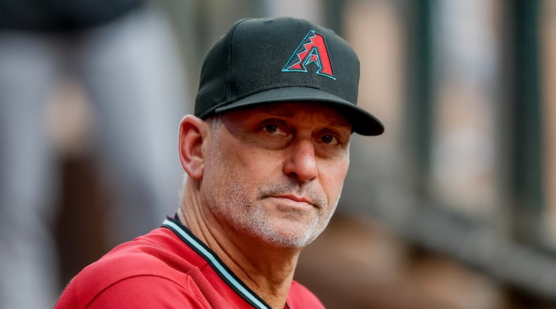 Arizona Diamondbacks manager Torey Lovullo in the dugout before the first pitch of a baseball game against the Atlanta Braves, Saturday, Aug. 15, 2026, in Atlanta. (AP Photo/Erik S. Lesser)