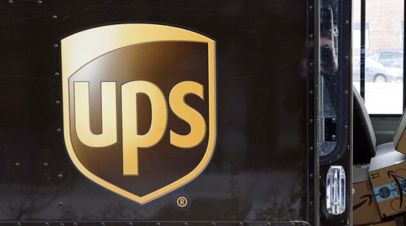 A woman was arrested in Spalding County by a deputy posing as a UPS driver after she signed for a package that was supposed to contain $16,000 defrauded from a Florida woman.