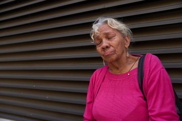 Yadira Almaraz, originally from Managua, Nicaragua, cries outside the ICE Los Angeles Staging Facility after visiting a young family member detained by federal agents in Los Angeles, on Wednesday, June 25, 2025. (AP Photo/Damian Dovarganes)