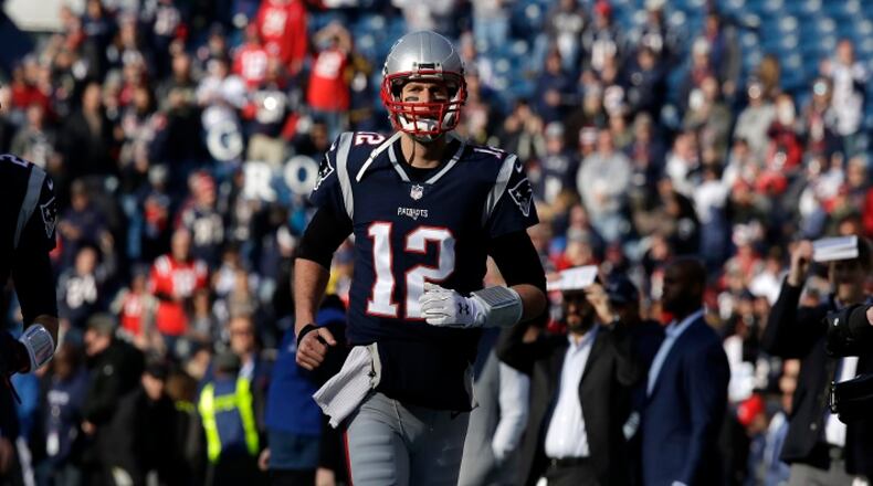 New England Patriots quarterback Tom Brady (12) warms up before the AFC championship NFL football game against the Jacksonville Jaguars, Sunday, Jan. 21, 2018, in Foxborough, Mass. (AP Photo/Charles Krupa)