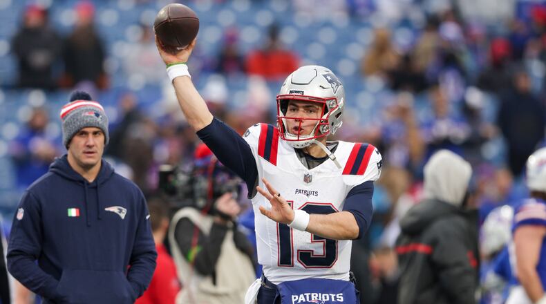 New England Patriots quarterback Nathan Rourke (13) warms up before an NFL football game, Sunday, Dec. 31, 2023, in Orchard Park, NY. (AP Photo/Matt Durisko)