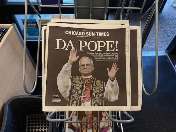 Chicago Sun Times newspaper front page showing Pope Leo XIV is seen on a newspaper rack at a store, Friday, May 9, 2025, in Chicago. (AP Photo/Melina Walling)