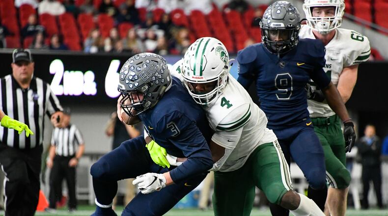 Athens Academy LB Len'neth Whitehead (4) takes down Eagle's Landing Christian Academy QB Brayden Rush during a class A Private high school championship football game at Mercedes-Benz Stadium, Wednesday, Dec. 12, 2018 in Atlanta. (John Amis/Special)