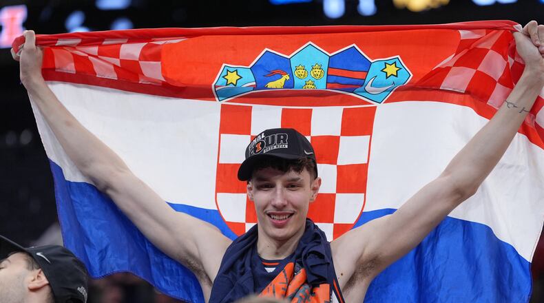 Illinois' Zvonimir Ivisic celebrates after an Elite Eight game against Iowa in the NCAA college basketball tournament Saturday, March 28, 2026, in Houston. (AP Photo/Eric Gay)