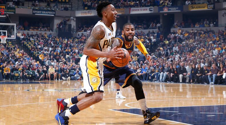 Jeff Teague of the Indiana Pacers drives to the basket against Kyrie Irving of the Cleveland Cavaliers in the first half of Game 4 of the Eastern Conference Quarterfinals during the 2017 NBA Playoffs at Bankers Life Fieldhouse on April 23, 2017 in Indianapolis, Indiana. (Photo by Joe Robbins/Getty Images)