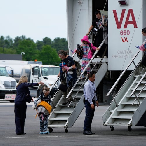 FILE - Afrikaner refugees from South Africa, arrive May 12, 2025, at Dulles International Airport in Dulles, Va. (AP Photo/Julia Demaree Nikhinson, File)