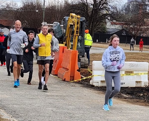 Richard Westbrook, a retired cross country coach from Jonesboro, marks a streak of running every day for 50 years during a run last week at Piedmont Park.