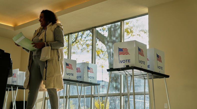 FILE - People wait to cast their ballot at the Horatio Williams Foundation in downtown Detroit, Tuesday, Nov. 4, 2025. (AP Photo/Ryan Sun,File)