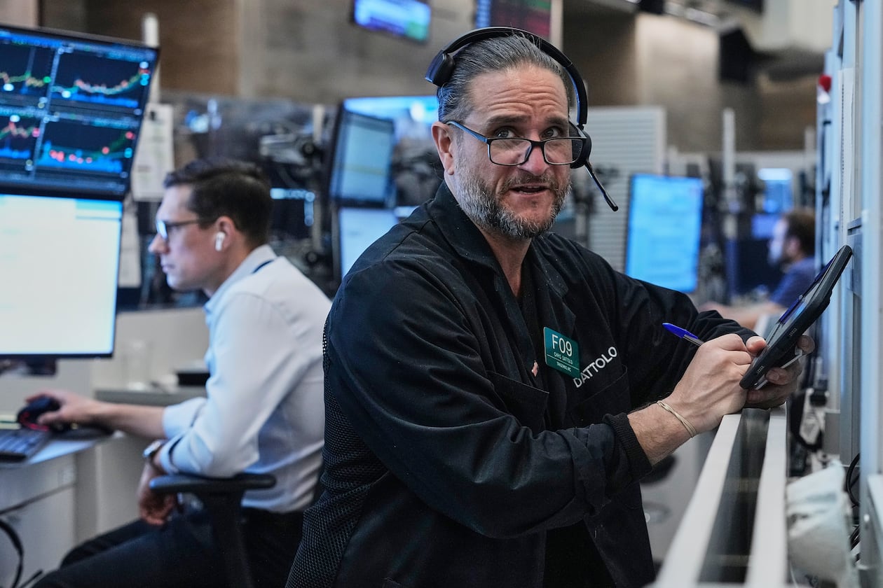 Options trader Chris Daytona, right, works on the floor of the New York Stock Exchange, Wednesday, June 3, 2026. (AP Photo/Richard Drew)