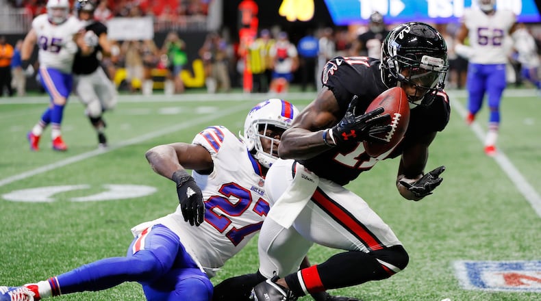 Falcons wide receiver Julio Jones makes a catch over Tre'Davious White of the Buffalo Bills during the first half at Mercedes-Benz Stadium on Oct. 1, 2017, in Atlanta.