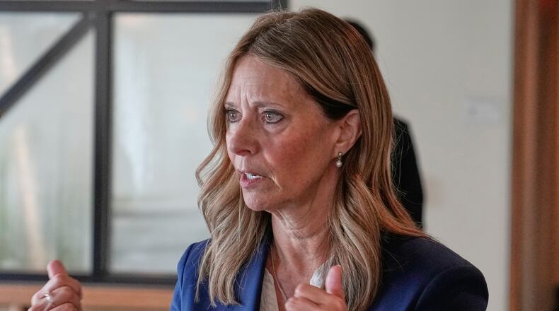 FILE - Amy Acton, Democratic candidate for Governor of Ohio, gestures as she speaks with a reporter in Columbus, Ohio April 15, 2026. (AP Photo/Sue Ogrocki, File)