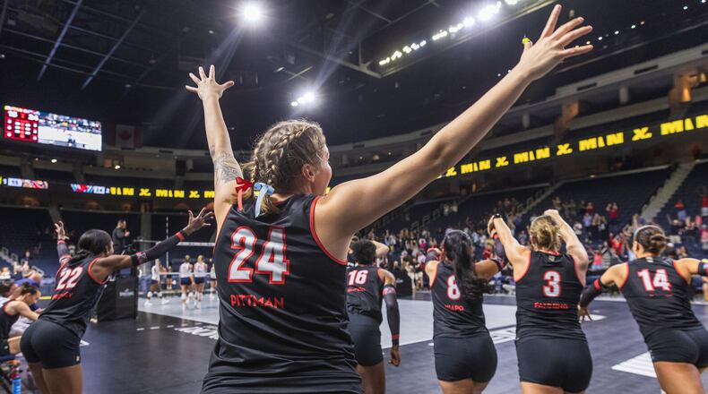 Members of the Atlanta Vibe volleyball team celebrate a recent victory.