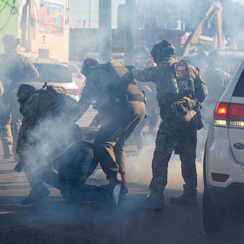 FILE - Federal immigration enforcement agents detain a protester in the Little Village neighborhood of Chicago on Oct. 23, 2025. (Anthony Vazquez/Chicago Sun-Times via AP, File)