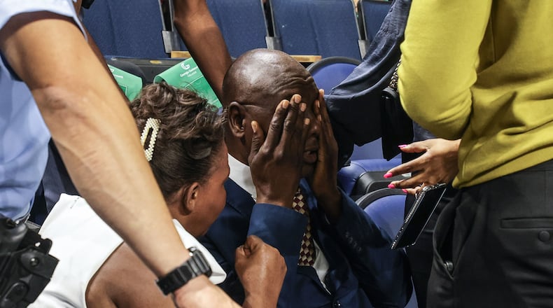 Helas Cenescar , father of Georgia State Patrol Trooper Jimmy Cenescar cries after being presented with an honorary diploma during Georgia Gwinnett College Graduation at Gas South Arena in Duluth on Thursday. Cenescar, who was supposed to graduate, was killed in the line of duty in January. (Natrice Miller/ AJC)