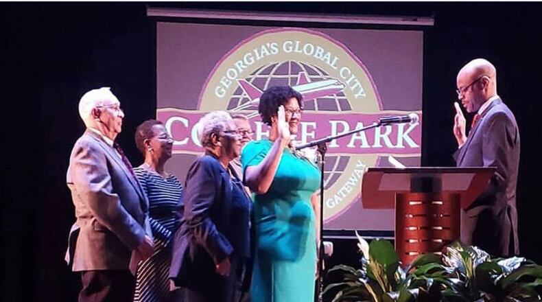 College Park Mayor-elect Bianca Motley Broom stands with her family during her swearing in ceremony Monday night. CONTRIBUTED
