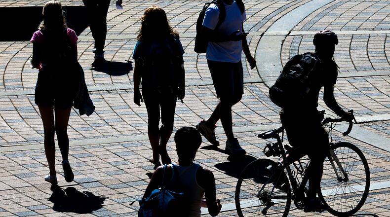 Atlanta: Taking in a sunny day on campus, some Georgia Tech students walked to class, others rode along the bricks of the Georgia Tech Plaza in front of the Kessler Campanile outside the Student Center Commons on Thursday, Aug. 25, 2016. JOHN SPINK /JSPINK@AJC.COM
