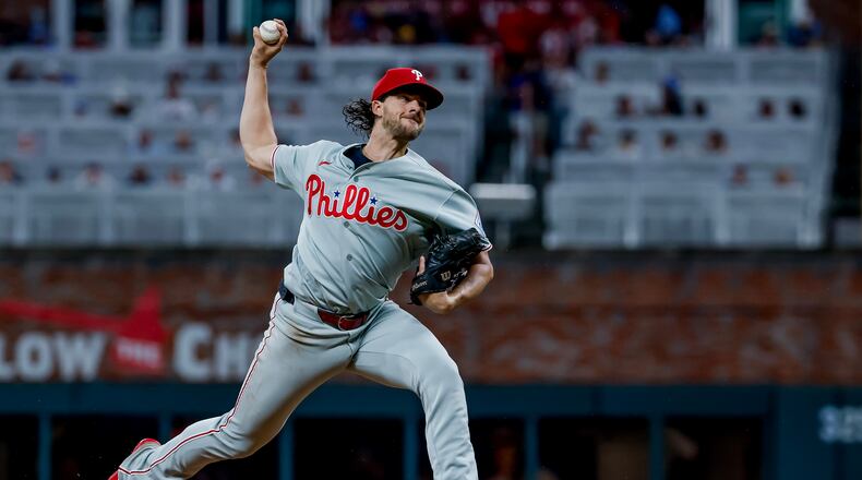 Philadelphia Phillies pitcher Aaron Nola delivers to an Atlanta Braves batter during the first inning of a baseball game, Friday, Sept. 11, 2026, in Atlanta. (AP Photo/Erik S. Lesser)