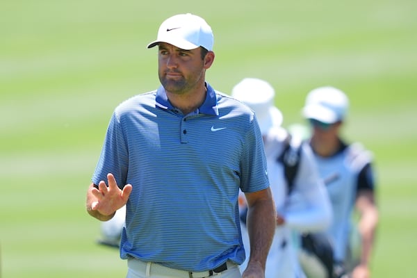 Scottie Scheffler waves after sinking a putt on the sixth green during the final round of the CJ Cup Byron Nelson golf tournament in McKinney, Texas, Sunday, May 4, 2025. (AP Photo/LM Otero)