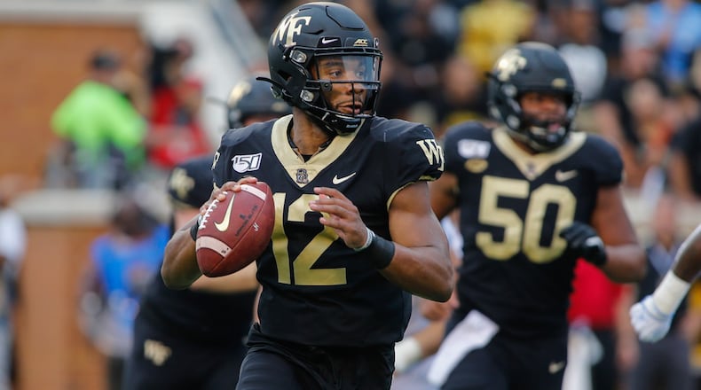 Wake Forest quarterback Jamie Newman looks to pass against North Carolina in Winston-Salem, N.C., Friday, Sept. 13, 2019. (AP Photo/Nell Redmond)