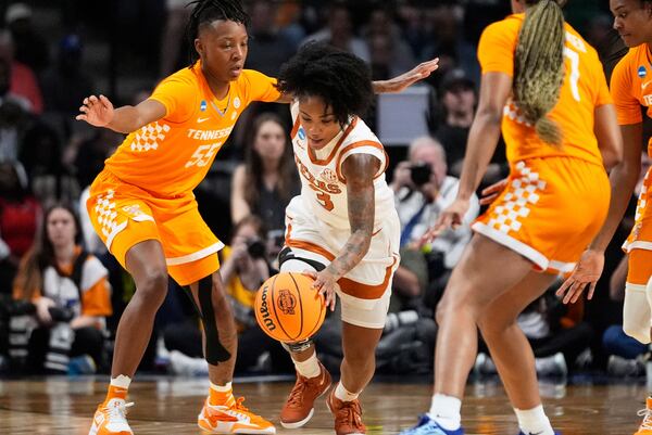 Texas guard Rori Harmon (3) moves the ball down court past Tennessee guard Talaysia Cooper (55) during the first half in the Sweet 16 of the NCAA college basketball tournament, Saturday, March 29, 2025. in Birmingham, Ala. (AP Photo/Gerald Herbert)