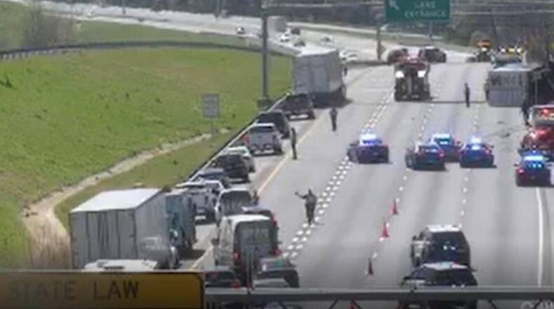 A crash involving a Department of Public Safety officer shut down several lanes of I-85 South in Gwinnett County on Friday.