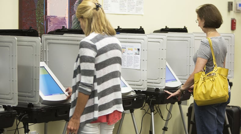Voters turn out at the Roswell Branch Public Library to cast ballots early in June’s 6th Congressional District special election. (Photo by Phil Skinner)