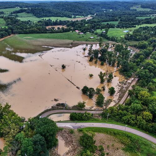 Remaining floodwater covers a portion of Roseville, Ohio, Wednesday, Aug. 12, 2026. (AP Photo/Gene J. Puskar)