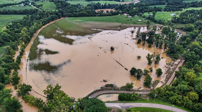Remaining floodwater covers a portion of Roseville, Ohio, Wednesday, Aug. 12, 2026. (AP Photo/Gene J. Puskar)