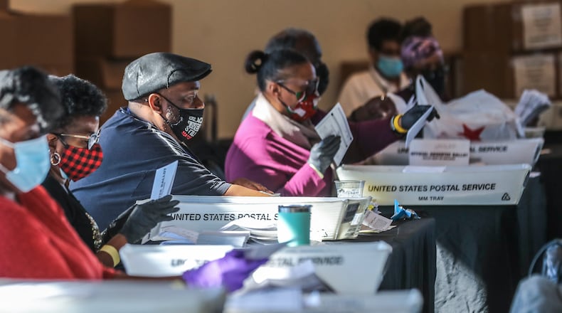 Fulton County election workers started counting and scanning ballots again Wednesday as the state and nation waited for the results. (John Spink / John.Spink@ajc.com)