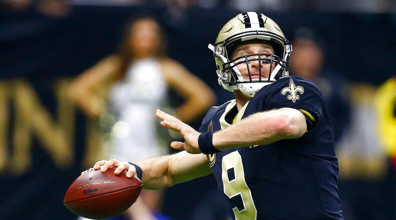 New Orleans Saints quarterback Drew Brees (9) works against against the Philadelphia Eagles in the first half of an NFL divisional playoff football game in New Orleans, Sunday, Jan. 13, 2019. (AP Photo/Butch Dill)