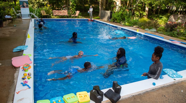 SwemKids instructors teach their students in William Fogler's backyard pool. After COVID shuttered pools, a Fayetteville man offered his backyard pool for swimming instruction & water safety lessons to Atlanta city kids. SwemKids is a nonprofit that offers free swimming gear & lessons as an in-school program for kids in low income neighborhoods. PHIL SKINNER FOR THE ATLANTA JOURNAL-CONSTITUTION.