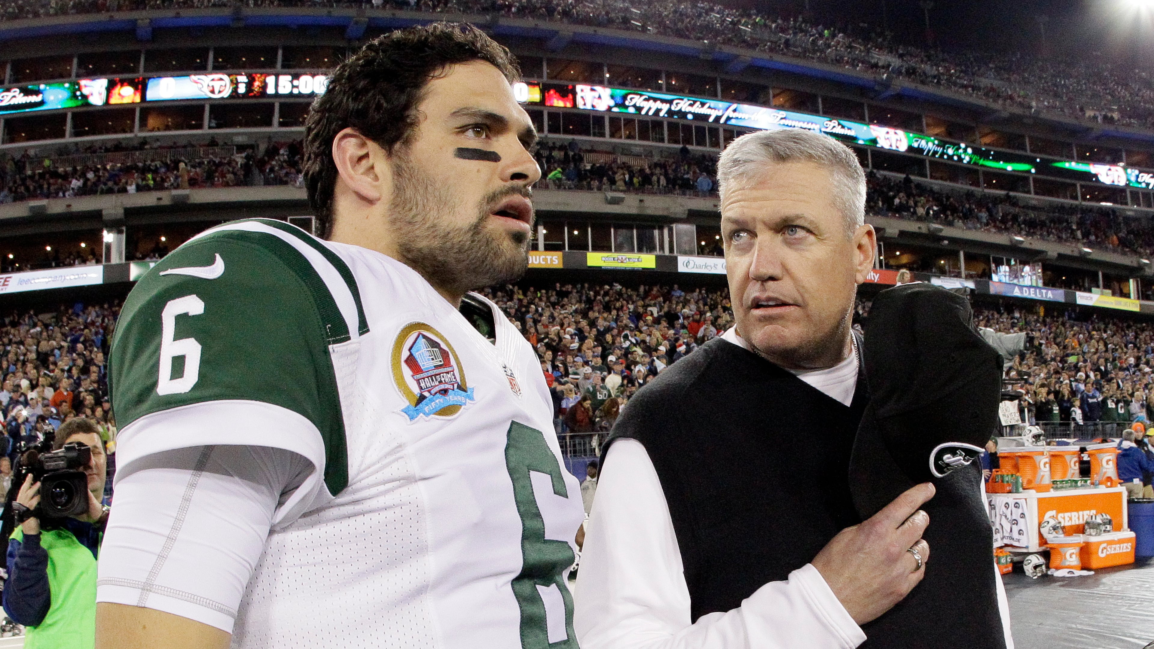 FILE - New York Jets head coach Rex Ryan, right, talks with quarterback Mark Sanchez (6) before an NFL football game between the Tennessee Titans and the New York Jets on Monday, Dec. 17, 2012, in Nashville, Tenn. (AP Photo/Wade Payne, File)