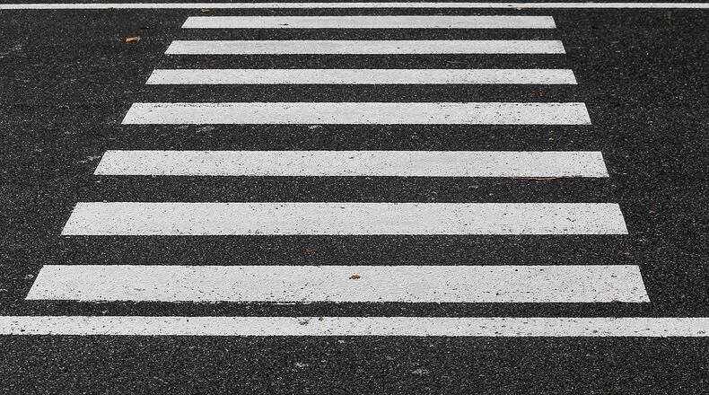 Officials in Ames, Iowa, said they received a letter from federal transportation officials to comply with standards that call for crosswalks that are not multi-colored.