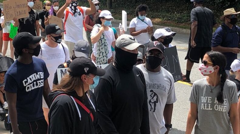 Falcons coach Dan Quinn and wife, Stacey (to his right), taking part in a protest march in Buckhead on Sunday, June 7, 2020. (By D. Orlando Ledbetter/dledbetter@ajc.com)