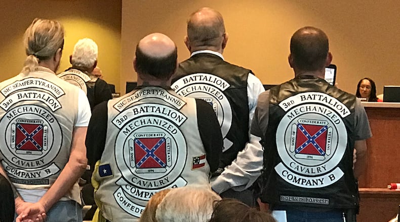 Members of the Sons of Confederate Veterans at the commission meeting Tuesday. Commissioner Dee Clemmons, the object of their ire, is at right. (Rosalind Bentley / rbentley@ajc.com)