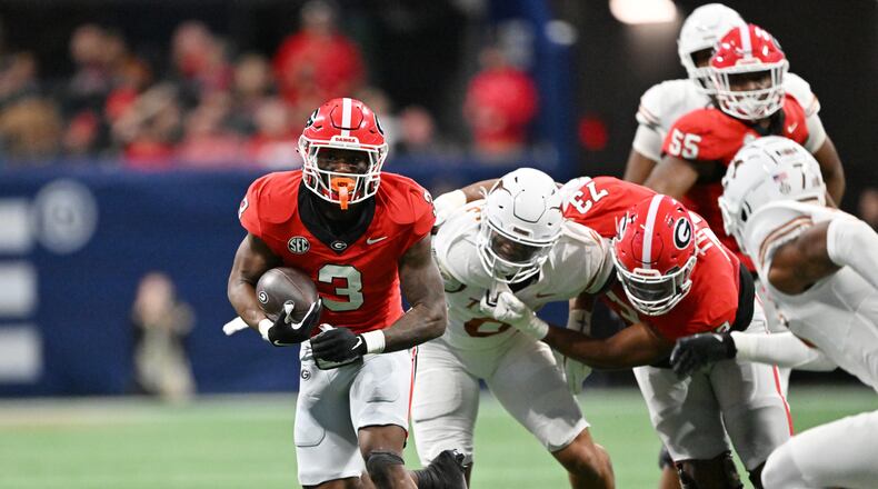 Georgia running back Nate Frazier (3) breaks away for a long first down run during the second half in the SEC Championship football game at the Mercedes-Benz Stadium, Saturday, December 7, 2024, in Atlanta. Georgia won 22-19 over Texas in overtime. (Hyosub Shin / AJC)