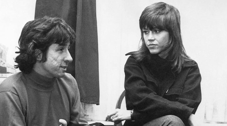 FILE - In this Dec. 26, 1972 file photo, actress Jane Fonda, right, and Tom Hayden, one of the founders of SDS, talk at the home of a friend in London, after their arrival from Paris. Hayden, the famed 1960s anti-war activist who moved beyond his notoriety as a Chicago 8 defendant to become a California legislator, author and lecturer, has died at age 76. His wife, Barbara Williams, says Hayden died on Sunday, Oct. 23, 2016, in Santa Monica of a long illness. (AP Photo, File)